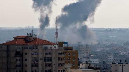 Smoke rises following an Israeli attack on Gaza City, Thursday, Nov. 15, 2012. Israel barraged the Gaza Strip with airstrikes and shelling Wednesday and killed the Hamas military chief in a targeted strike, launching a campaign aimed at stopping rocket attacks from Islamic militants. The assault killed 10 other Palestinians, including two children and seven militants. On Thursday, militant rockets fired into Israel killed three Israelis, raising the likelihood of a further escalation.(AP Photo/Adel Hana)