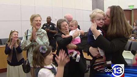 Dozens of children who ended up in foster care now have permanent families after a mass adoption ceremony.