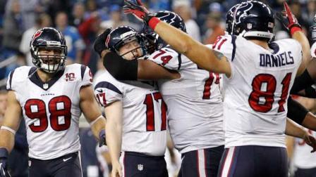 Houston Texans kicker Shayne Graham (17) is mobbed by teammates Wade Smith (74) and Owen Daniels (81) after kicking the game-winning field goal in overtime of an NFL football game against the Detroit Lions at Ford Field in Detroit, Thursday, Nov. 22, 2012. Looking on at left is Connor Barwin. The Texans won 34-31. (AP Photo/Rick Osentoski)