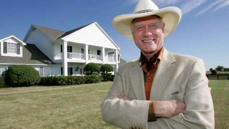 Actor Larry Hagman poses in front of the Southfork Ranch mansion made famous in the television show, Dallas, in Parker, Texas, Thursday Oct. 9, 2008. (AP Photo/Tony Gutierrez) | Hagman died Friday, November 23, 2012, due to complications from his battle with cancer.