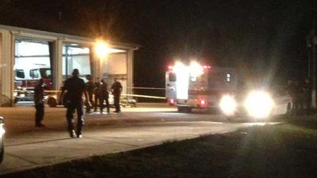 Investigators outside the Rosehill fire station on F.M. 2920 where a shooting victim collapsed and died