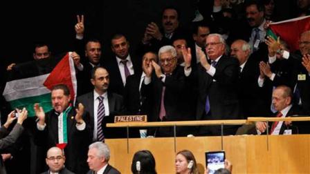 President of the Palestinian National Authority Mahmoud Abbas, center, celebrates with members of his delegation and other supporters after the U.N. General Assemblys historic vote to recognize Palestine as its 194th State at U.N. Headquarters, Thursday, Nov. 29, 2012. (Jason DeCrow/AP Images for Avaaz)