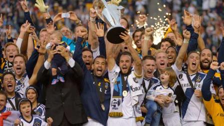Los Angeles Galaxs Landon Donovan hoist the trophy as they celebrate after defeating the Houston Dynamo 3-1 in the MLS Cup championship soccer game, Saturday, Dec. 1, 2012, in Carson, Calif. AP Photo/Mark J. Terrill)