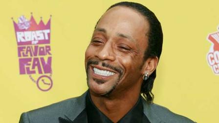 Katt Williams, wearing a moneybag necklace with his initial on it, arrives at the Comedy Central Roast of Flavor Flav in Burbank, Calif., in this July 22, 2007, file photo. While cracking jokes at the Laugh Factory on Sunday night, Feb. 10, 2008, the comedian handed out $100 bills to the audience, according to Laugh Factory owner Jamie Masada. (AP Photo/Matt Sayles, file)