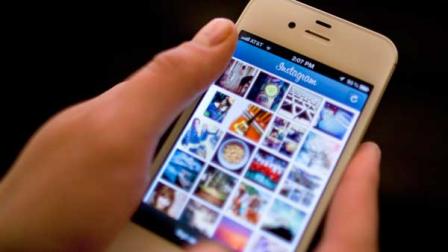 In this Monday, April 9, 2012, file photo, Instagram is demonstrated on an iPhone, in New York. (AP Photo/Karly Domb Sadof, File)