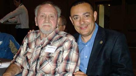 In this April 21, 2010 photo provided by the Austin Police Department, retired APD officer Houston McCoy, left, poses with police chief Art Acevedo, right, in Austin, Texas. McCoy, the Austin police officer who helped stop Charles Whitmans 1966 sniper rampage from atop the University of Texas tower, has died. He was 72. (AP Photo/Austin Police Department, File)