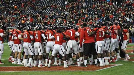 Texas Tech University Red Raiders huddle ahead of the Meineke Bowl at Reliant Stadium