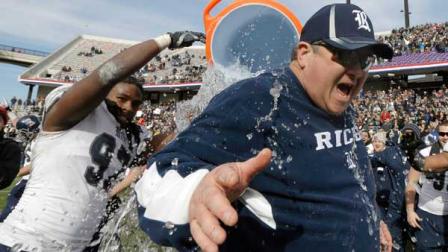 Rice head coach David Bailiff is drenched in water by defensive end Jared Williams (97) after the end of the Armed Forces Bowl NCAA college football game against Air Force, Saturday, Dec. 29, 2012, in Fort Worth, Texas. Rice won 33-14. (AP Photo/LM Otero)
