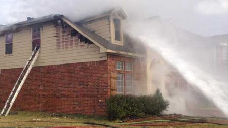 Investigators believe flames from a fireplace caught the townhomes roof on fire.