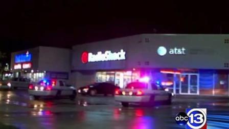 Police at a Radio Shack on North Gessner near the Katy Freeway where an officer discharged a weapon at an armed suspects but missed, officials said