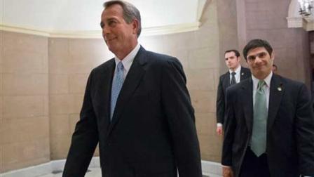 This Jan. 15, 2013 file photo shows House Speaker John Boehner of Ohio walking on Capitol Hill in Washington. Republican leaders scramble for votes on a stopgap debt-limit measure that would let the government keep borrowing until at least mid-May, giving up for now on trying to win spending cuts from Democrats in return. But the respite would be only temporary, with major battles still to come between the GOP and President Barack Obama over taxes, spending and deficits. (AP Photo/J. Scott Applewhite, File)