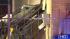 A sports car slams into an apartment complex on...