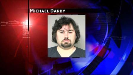 Michael Darby, 27, is charged with possession of child pornography