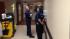Galveston firefighters stand by in the hallways...