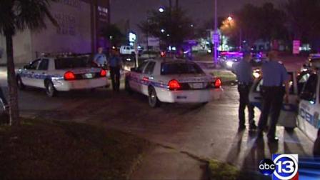 Houston police at the scene of a robbery in southwest Houston where two gunmen ambushed four men and stole their belongings