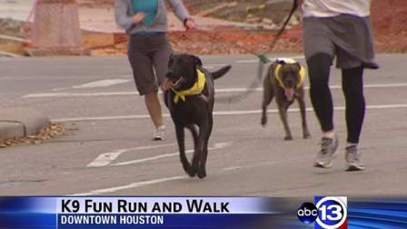 Two- and four-legged participants race others to the finish line at the annual Houston Humane Society K-9 Fun Run
