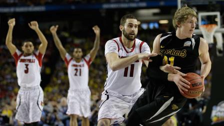 Wichita States Ron Baker (31) and Louisvilles Luke Hancock move during the second half of the NCAA Final Four tournament college basketball semifinal game Saturday, April 6, 2013, in Atlanta. Louisville won 72-68. (AP Photo/David J. Phillip)