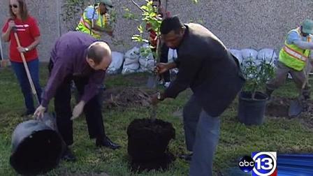Dozens of people came together Monday morning at the Wesley Community Center to plant trees for Earth Day.