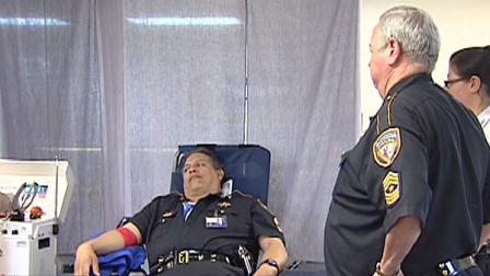 Dozens of local law enforcement officers Monday gave the gift of life to help a fellow officer fight cancer.