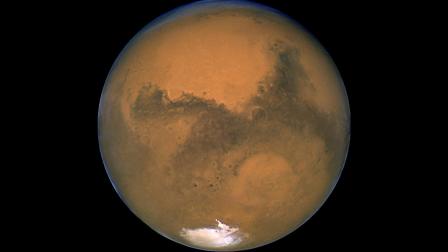 This Aug. 26, 2003 image made available by NASA shows Mars photographed by the Hubble Space Telescope on the planets closest approach to Earth in 60,000 years. (AP Photo/NASA)