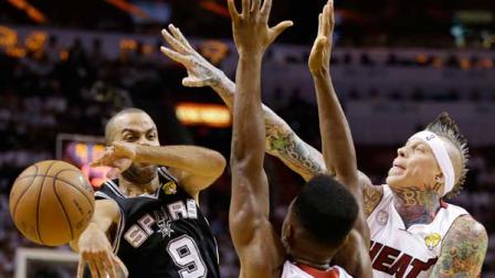 San Antonio Spurs point guard Tony Parker (9) passes the ball against Miami Heat point guard Norris Cole (30) and Miami Heat power forward Chris Andersen (11) during the first half of Game 1 of basketballs NBA Finals, Thursday, June 6, 2013 in Miami. (AP Photo/Lynne Sladky)