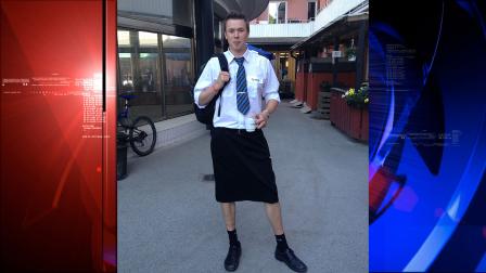 Swedish train driver Martin Akersten poses wearing a skirt