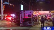 A man is facing felony DWI charges after police say he ran a red light and hit an ambulance, injuring two firefighters and his infant.