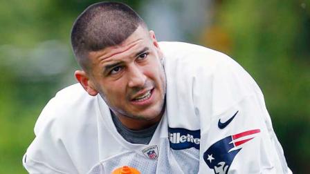 New England Patriots Aaron Hernandez kneels on the field during NFL football practice in Foxborough, Mass., Wednesday, May 29, 2013. (AP Photo/Michael Dwyer)