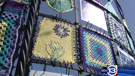Yarn-bombing is a public art movement that involves covering anything with knitted and crocheted yarn creations. This installation is now up in The Heights, replacing one that was destroyed by a vandal.