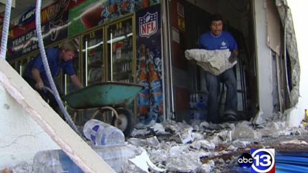 The owner of this Humble store is cleaning up after a vehicle crashed through the wall