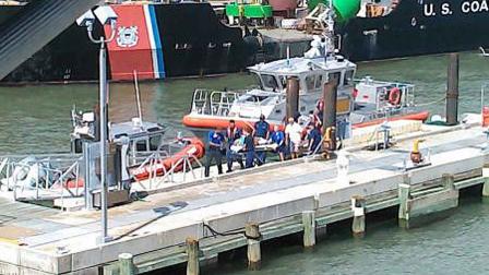 Crewmembers from Coast Guard Station Galveston transport a medevaced victim to Emergency Medical Services, July 6, 2013.