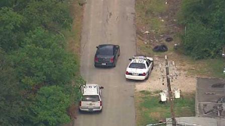 Detectives investigate the death of a woman whose partially clothed body was found wrapped in blankets in a wooded area in northeast Houston.