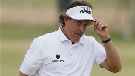 Phil Mickelson of the United States gestures after a birdie on the 17th hole during the final round of the British Open Golf Championship at Muirfield, Scotland, Sunday July 21, 2013. (AP Photo/Jon Super)
