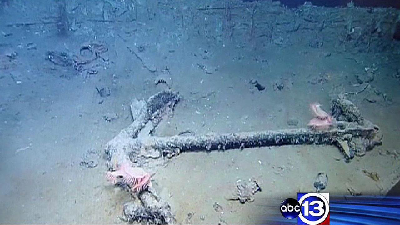 Research scientists and archeologists recovering artifacts from