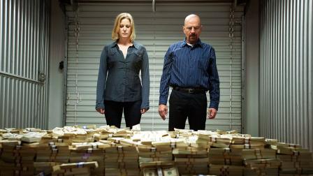 This image released by AMC shows Skyler White, played by Anna Gunn, left, looking over a stash of money with her husband Walter White, played by Bryan Cranston, in season five of Breaking Bad.