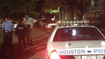 Houston police at the scene of a shooting on Greens Road in north Houston where they say a teen was shot in the face during a struggle with his brother, a security guard