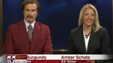 Will Ferrell, as his Anchorman character Ron Burgundy, co-anchors the evening news with Amber Schatz