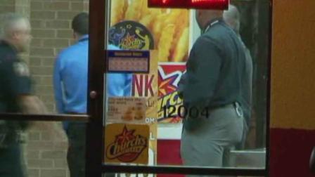 Investigators at the scene of a shooting at a Churchs Chicken in Harris County