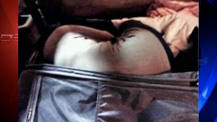 Woman in luggage