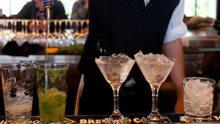 bartender prepares alcoholic drinks