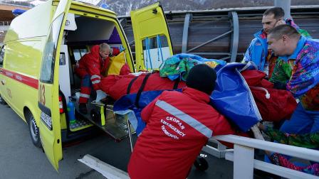 A track worker is loaded into an ambulance