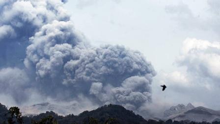 Mount Kelud erupts, as seen from Anyar village in Blitar, East Java, Indonesia, Friday, Feb. 14, 2014
