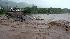 Residents watch a bridge that collapsed due to heavy rains caused by Tropical Storm Gustav in Kingston, Friday, Aug. 29, 2008. (AP Photo/Collin Reid)
