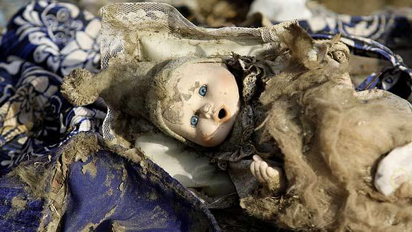 A doll sits among debris in the aftermath of Hurricane Ike Wednesday, Sept. 24, 2008 in Galveston, Texas. Thousands of people returned on Wednesday for the first time since their island city was blasted by Hurricane Ike nearly two weeks ago. (AP Photo/David J. Phillip)
