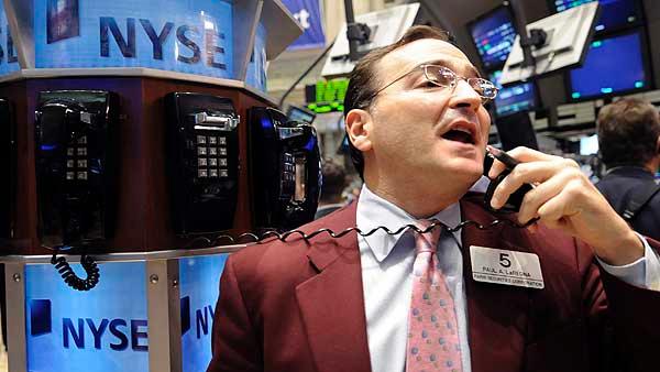 Trader Paul LaRegina works on the floor of the New York Stock Exchange Friday, Nov. 21, 2008. (AP Photo/Richard Drew)