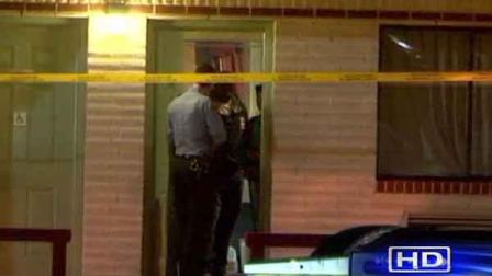 Police investigating at the scene of a double stabbing outside a motel on the Eastex Freeway