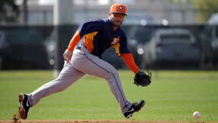 ouston Astros infielder Jose Altuve fields a ground ball during a spring training baseball workout Saturday, Feb. 16, 2013, in Kissimmee, Fla. (AP Photo/David J. Phillip)