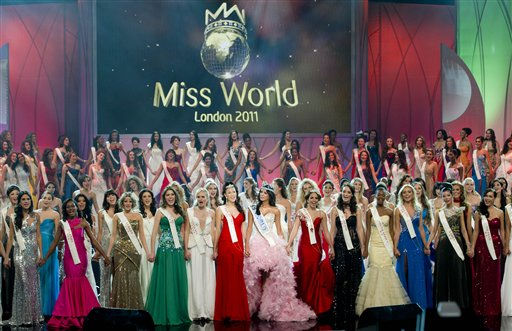 Miss Venezuela Ivian Sarcos, center, waves...