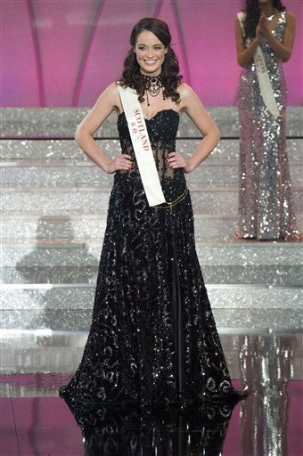 Miss Venezuela Ivian Sarcos, center, waves...