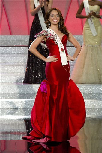 Miss Venezuela Ivian Sarcos, center, waves...